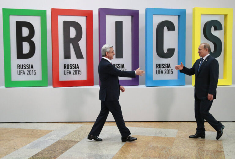 Russian President Vladimir Putin welcomes Armenian President Serzh Sargsyan, left, in Ufa, Russia, Thursday, July 9, 2015. Ufa hosts SCO (Shanghai Cooperation Organization) and BRICS (Brazil, Russia, India, China and South Africa) summits. (AP Photo/Ivan Sekretarev)