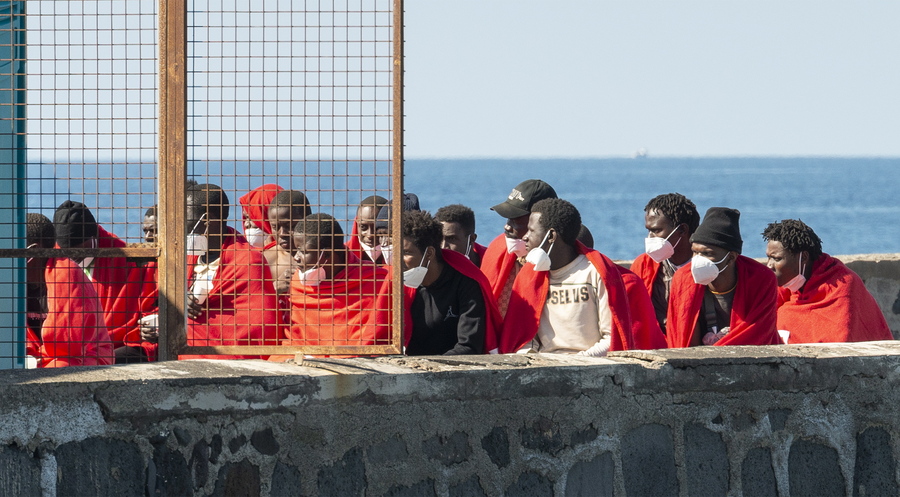 epa10596334 A group of the 41 Sub-Saharian immigrants who were rescued at the sea arrive at La Cebolla dock in Arrecige, Lanzarote, Canary Islands, Spain, 28 April 2023.  EPA/ADRIEL PERDOMO