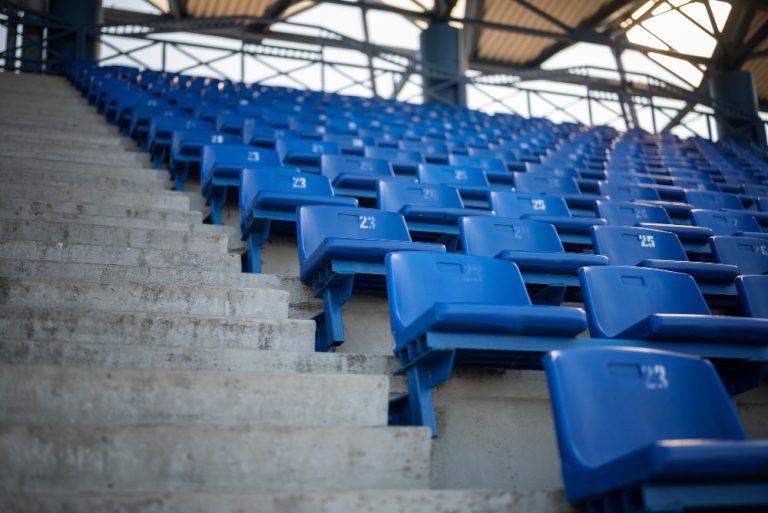 empty-blue-grandstands-low-angle