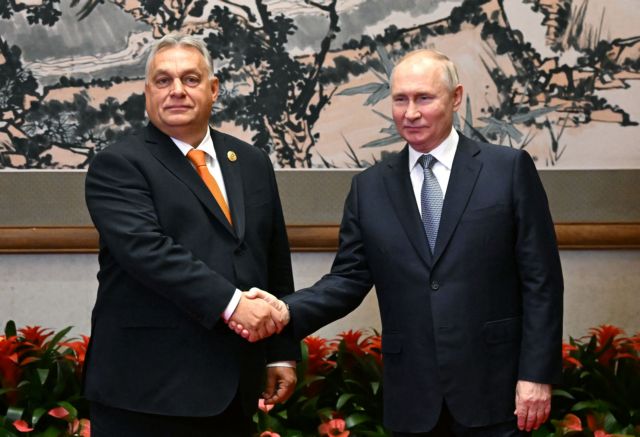 Russian President Vladimir Putin shakes hands with Hungarian Prime Minister Viktor Orban during a meeting ahead of the Belt and Road Forum in Beijing, China, October 17, 2023. Sputnik/Grigory Sysoyev/Pool via REUTERS ATTENTION EDITORS - THIS IMAGE WAS PROVIDED BY A THIRD PARTY.