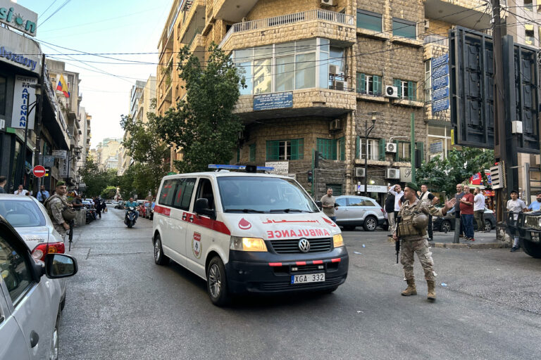 An ambulance rushes wounded people to a hospital in Beirut on September 17, 2024, after explosions hit locations in several Hezbollah strongholds around Lebanon amid ongoing cross-border tensions between Israel and Hezbollah fighters. Hundreds of people were wounded when Hezbollah members' paging devices exploded simultaneously across Lebanon on September 17, in what a source close to the militant movement said was an "Israeli breach" of its communications. (Photo by Anwar AMRO / AFP)