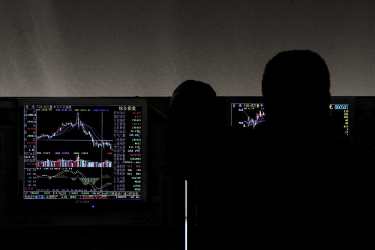 An investor monitors stock prices at a brokerage house in Beijing, Thursday, Jan. 3, 2019.  Asian markets were mixed on Thursday after tumbling more than 1 percent on the first trading day of 2019. Apple downgraded its sales projections, citing slowing Chinese growth, hitting technology shares in South Korea and Taiwan. The Japanese yen, seen as a relatively safe asset, strengthened against the dollar, euro and several other Asian and European currencies.(AP Photo/Andy Wong)