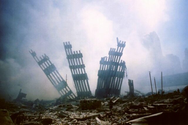 FILE - In this Sept. 11, 2001 file photo, the remains of the World Trade Center stands amid the debris following the terrorist attack on the building in New York.   Families of the victims of the worst terror attack on the United States in history gathered Wednesday, Sept. 11, 2013,  to mark their 12th anniversary with a moment of silence and the reading of names.  The Sept. 11, 2001 attacks in New York City and Washington killed almost 3,000 people and lead to a war in Afghanistan. (AP Photo/Alexandre Fuchs)