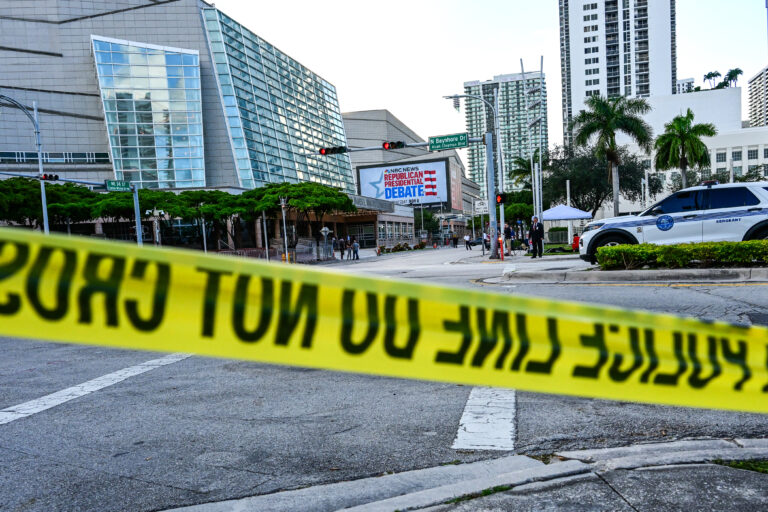 Police tape blocks off a road outside the Adrienne Arsht Center for the Performing Arts ahead of the third Republican presidential debate, in Miami, Florida, on November 8, 2023. (Photo by GIORGIO VIERA / AFP)