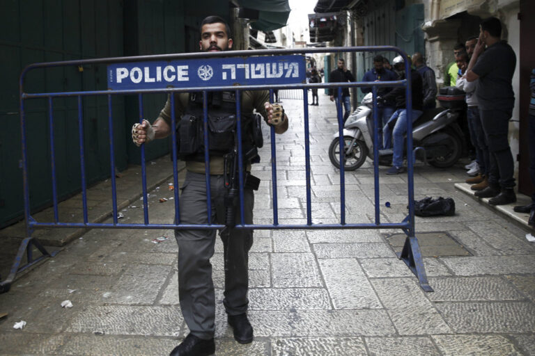 Israel border policeman blocks an alley in Jerusalem's Old City after a stabbing attack Saturday, April 1, 2017. Israeli police said they have shot dead a Palestinian who stabbed three people in the old city of Jerusalem. Spokeswoman said the man stabbed two Jewish youths Saturday before fleeing, with police forces giving chase. He then stabbed one of the policemen before he was shot and killed. (AP Photo/Mahmoud Illean)