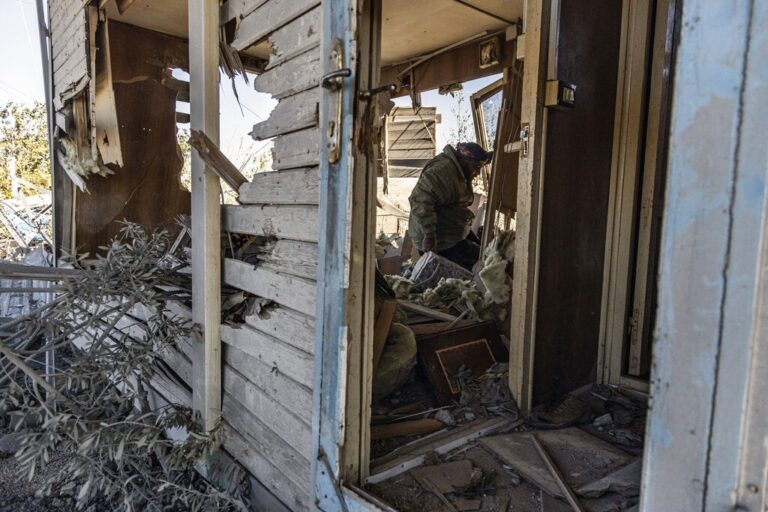 A man inspects a site damaged by Turkish airstrikes that hit an electricity station in the village of Taql Baql, in Hasakeh province, Syria, Sunday, Nov. 20, 2022. The Turkish Defense Ministry said Sunday that Turkey launched deadly airstrikes over northern regions of Syria and Iraq, targeting Kurdish groups that Ankara holds responsible for last week's deadly bomb attack in a bustling street in Istanbul. (AP Photo/Baderkhan Ahmad)