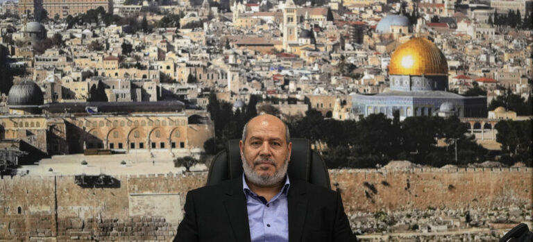 Khalil al-Hayya, a high-ranking Hamas official who has represented the Palestinian militant group in negotiations for a cease-fire and hostage exchange deal, sits in front of a backdrop showing the old city of Jerusalem during an interview with The Associated Press, in Istanbul, Turkey, Wednesday, April 24, 2024. (AP Photo/Khalil Hamra)