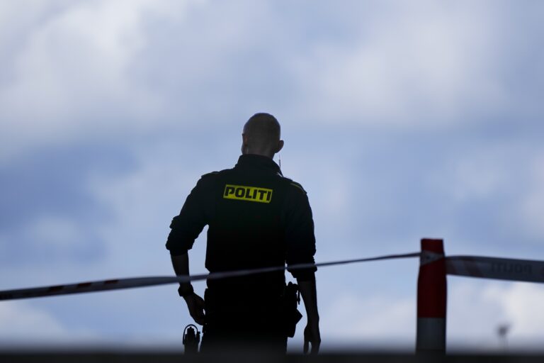 FILE - A police officer stands guard in Copenhagen, Denmark, on July 4, 2022. (AP Photo/Sergei Grits, File)