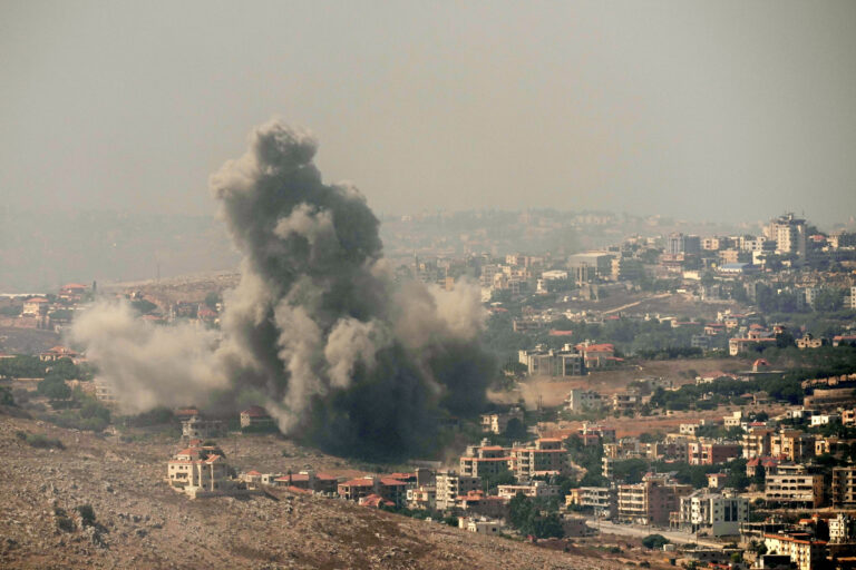 Smoke rises from Israeli airstrikes in the southern village of Kfar Rouman, seen from Marjayoun, south Lebanon, Wednesday, Sept. 25, 2024. (AP Photo/Hussein Malla)