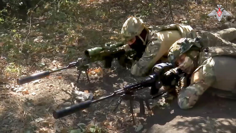 In this image made from video released by the Russian Defense Ministry on Wednesday, Oct. 2, 2024, Russian snipers, in an undisclosed location, fire towards Ukrainian forces. (Russian Defense Ministry Press Service via AP)