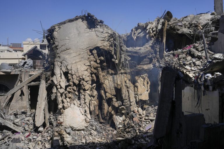 Damaged houses at the site of an Israeli airstrike in Baalbek, east Lebanon, Monday, Oct. 7, 2024. (AP Photo/Hassan Ammar)