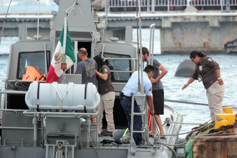 Mexican Navy personnel help Cuban migrants after being rescued in Cozumel, Mexico, Saturday, March 19, 2016. According to a U.S Coast Guard news release, "18 reported Cuban migrants were picked up by the Royal Caribbean's Brilliance of the Seas cruise ship west of Marco Island, Florida. The 18 migrants were reportedly suffering from severe dehydration and claimed they left Cuba 22 days ago where nine of the migrants perished at sea during the journey." (Angel Villegas via AP)