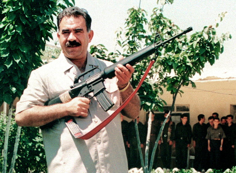 Abdallah Ocalan, leader of the Kurdistan Worker's Party, holds a US-made M16 sub-machine gun, in Lebanon's Bekaa Valley, in June 1997. Ocalan was captured in Kenya recently and hauled to Turkey to stand trial on terrorism charges. (Photo by AFP)