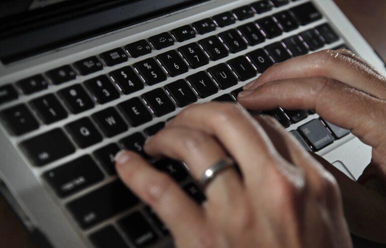 FILE - A person works on a laptop on June 19, 2017, in North Andover, Mass. As more of our lives move online, our personal data like email addresses, phone numbers, birthdates and even passcodes are becoming ever more vulnerable to theft or being mistakenly exposed. (AP Photo/Elise Amendola, File)