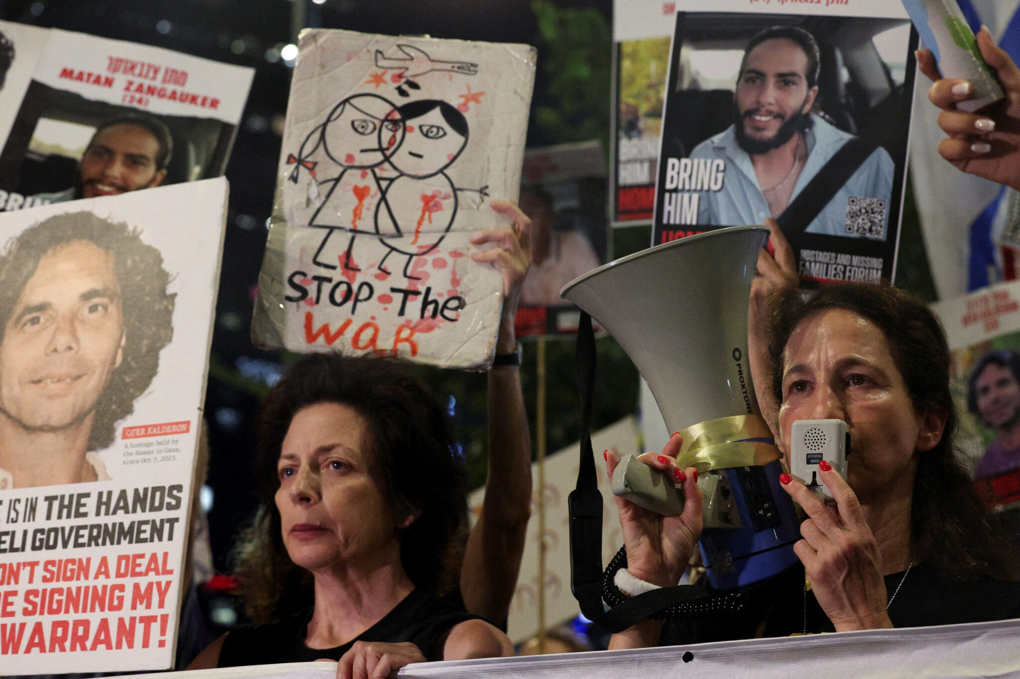 A demonstrator holds a megaphone, as families and supporters of hostages kidnapped during the deadly October 7, 2023 attack, protest against the government and to demand their immediate release, amid the ongoing conflict in Gaza between Israel and Hamas, in Tel Aviv, Israel, October 17, 2024. REUTERS/Violeta Santos Moura