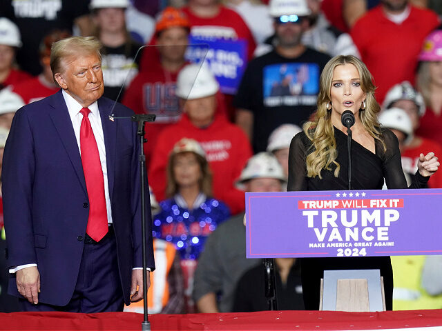 Republican presidential nominee former President Donald Trump listens as Megyn Kelly speaks at a campaign rally at PPG Paints Arena, Monday, Nov. 4, 2024, in Pittsburgh. (AP Photo/Matt Freed)