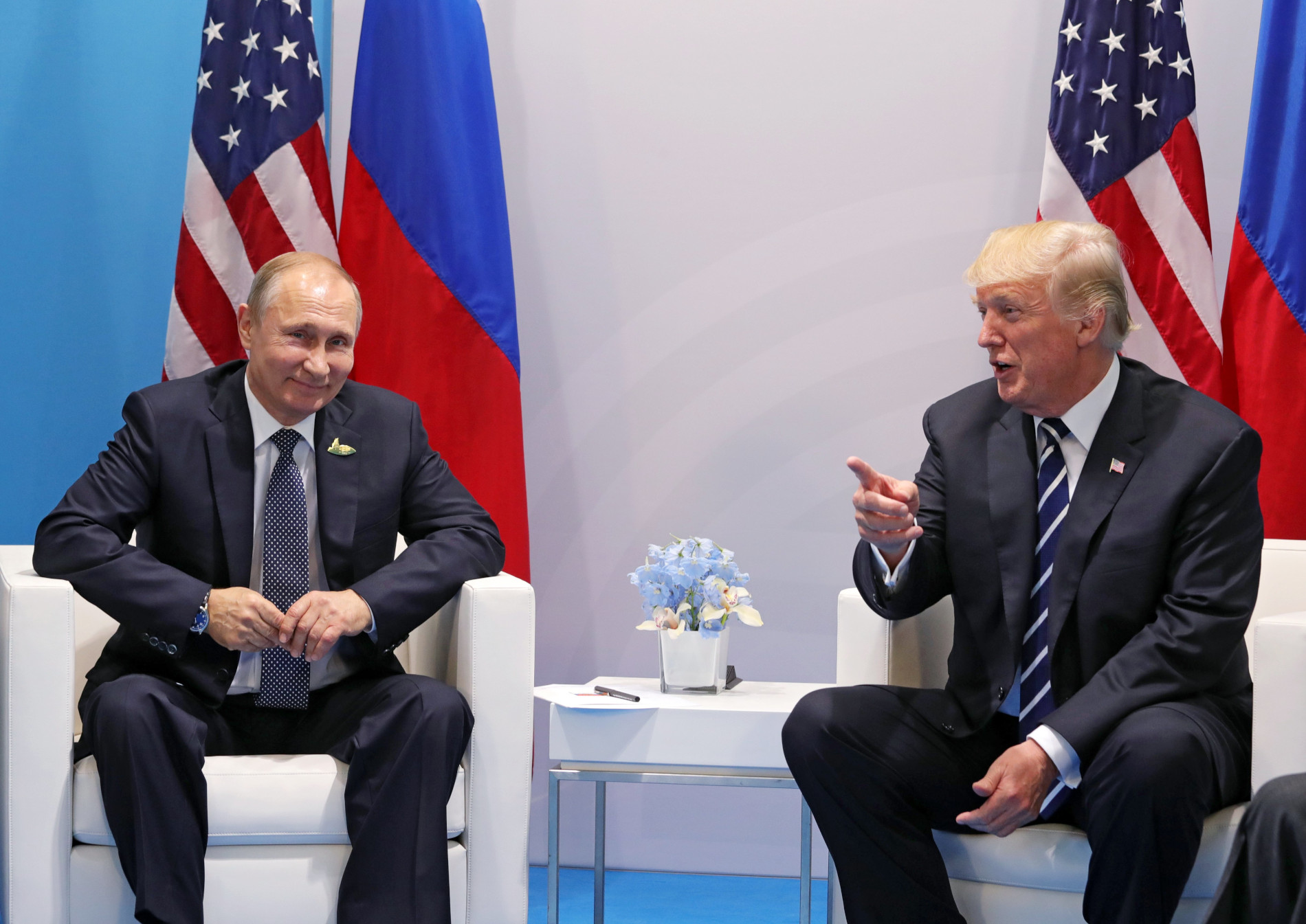 epa06073363 Russian President Vladimir Putin (L) and US President Donald J. Trump (R) meet on the sidelines of the G20 summit in Hamburg, Germany, 07 July 2017. The G20 Summit (or G-20 or Group of Twenty) is an international forum for governments from 20 major economies. The summit is taking place in Hamburg from 07 to 08 July 2017.  EPA/MICHAEL KLIMENTYEV / SPUTNIK / KREMLIN POOL / POOL MANDATORY CREDIT