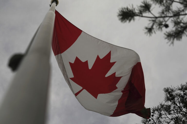 The Canadian flag is blown by wind on Centre Island in Toronto on Thursday, Sept. 19, 2024. (AP Photo/Angie Wang)