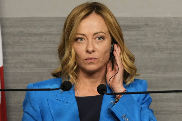 Italian Premier Giorgia Meloni, adjusts her headphone during a joint press conference with Lebanon’s caretaker prime minister Najib Mikati, Friday, Oct. 18, 2024, in Beirut, Lebanon. (AP Photo/Hassan Ammar)