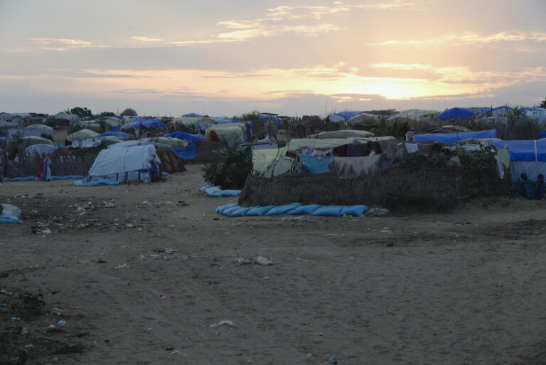 The sun sets over the camp set up for refugees who fled war in Sudan in Adre, Chad, Thursday, Oct. 3, 2024. (AP Photo/Sam Mednick)