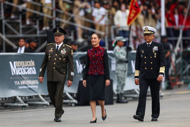 Mexico's Defense Minister Ricardo Trevilla Trejo, Mexico's President Claudia Sheinbaum and Secretary of the Navy Raymundo Pedro Morales walk as they take part in the parade to mark the 114th anniversary of the Mexican Revolution, in Mexico City, Mexico November 20, 2024. REUTERS/Raquel Cunha