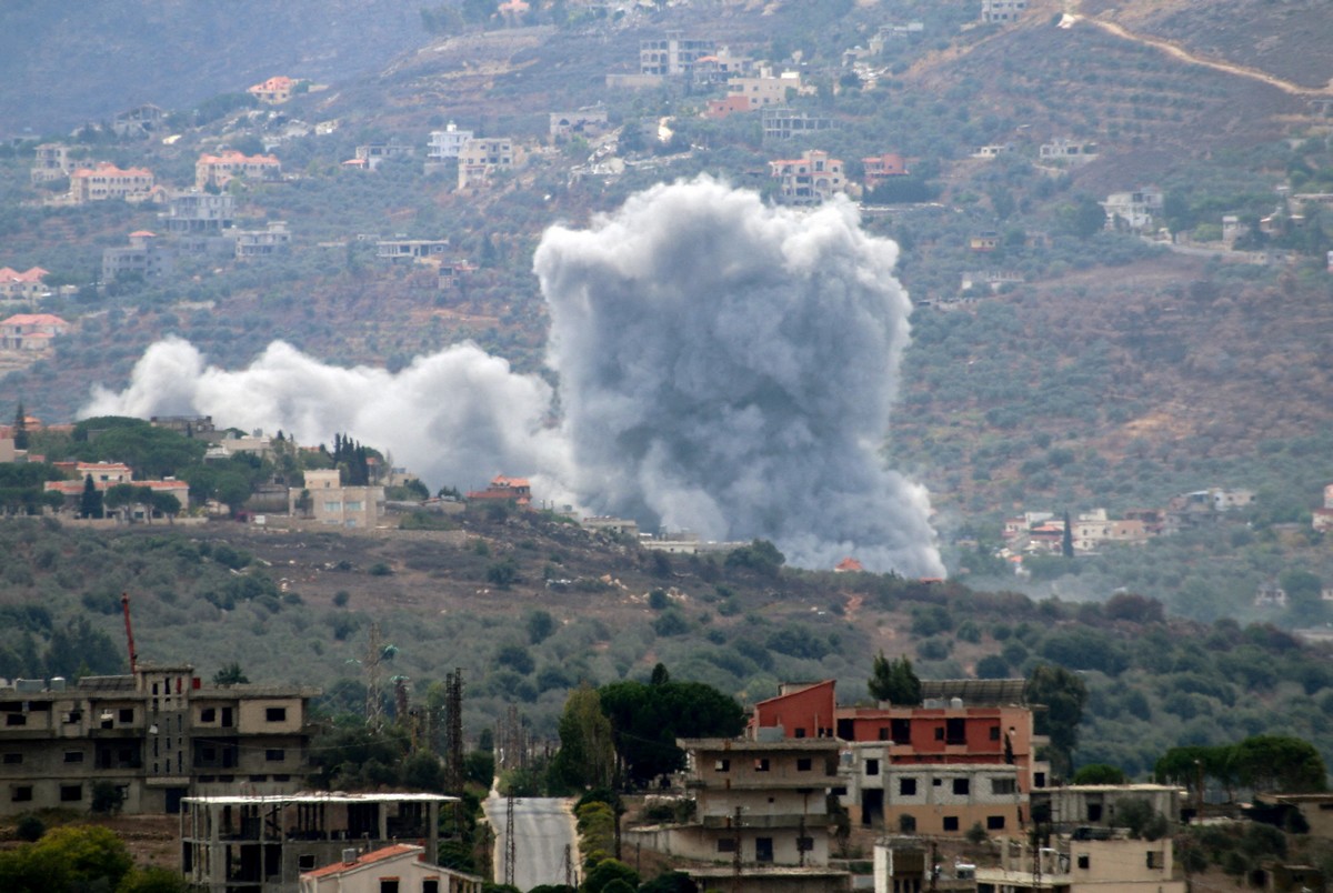 Smoke rises from the southern Lebanese village of Kfar Kila, amid ongoing cross-border hostilities between Hezbollah and Israeli forces, as pictured from Marjayoun, near the border with Israel, September 20, 2024. REUTERS/Karamallah Daher     TPX IMAGES OF THE DAY