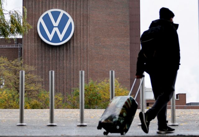 A person carries luggage near the Volkswagen power plant in Wolfsburg, Germany October 30, 2024. REUTERS/Axel Schmidt