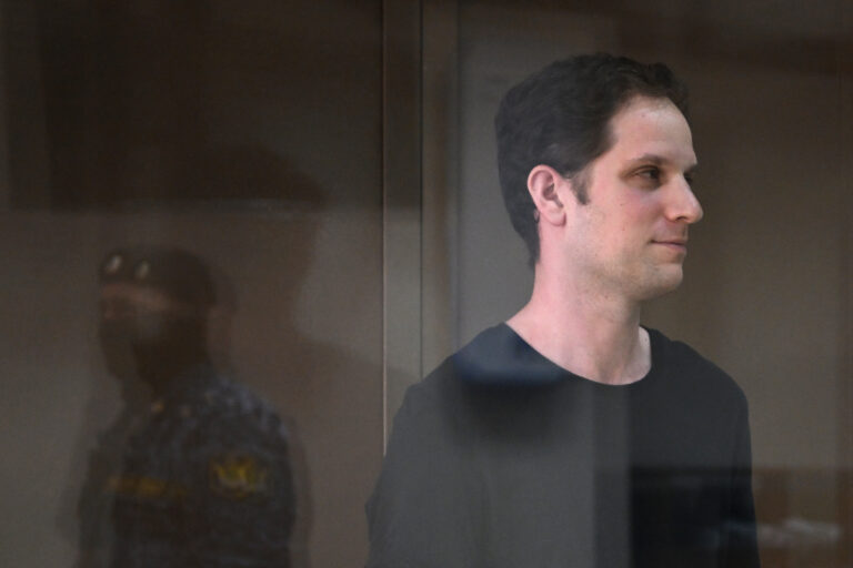 (FILES) US journalist Evan Gershkovich, arrested on espionage charges, stands inside a defendants' cage before a hearing to consider an appeal on his extended detention at The Moscow City Court  in Moscow on June 22, 2023. Russian court says to rule on extending US journalist Evan Gershkovich's detention on August 23, 2023. (Photo by Natalia KOLESNIKOVA / AFP)