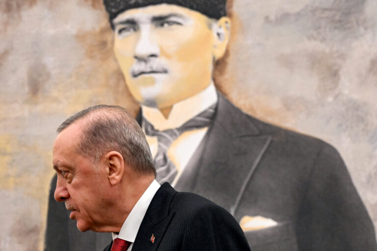 Turkey's President Recep Tayyip Erdogan stands before a picture of the founder and first president of the Turkish Republic Mustafa Kemal Ataturk, during his meeting with the visitig US Secretary of State at Ankara Esenboga Airport on December 12, 2024. (Photo by ANDREW CABALLERO-REYNOLDS / POOL / AFP)