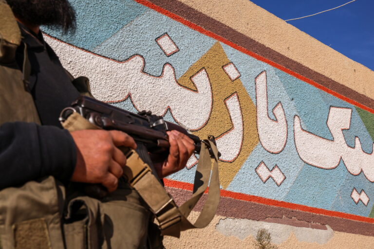 epa11754245 A member of the Syrian opposition stands at a military position allegedly used by Iranian forces after it was captured by the Syrian opposition in the city of Khan Sheikhoun, Idlib countryside, Syria, 03 December 2024. Syrian opposition forces, led by the Islamist militant group Hayat Tahrir al-Sham (HTS), launched an offensive on 27 November, taking large parts of Aleppo, Syria's second-largest city. The offensive triggered counterattacks by the Syrian regime forces as well as Russian and Syrian airstrikes on opposition-controlled areas.  EPA/MOHAMMED AL RIFAI