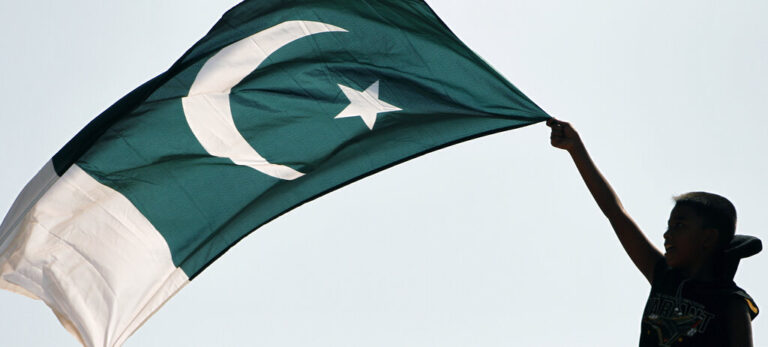 A young cricket fan waves Pakistan's national flag before the start of the Cricket World Cup match between Australia and Pakistan in Colombo, Sri Lanka, Saturday March 19, 2011. (AP Photo/Andres Leighton)