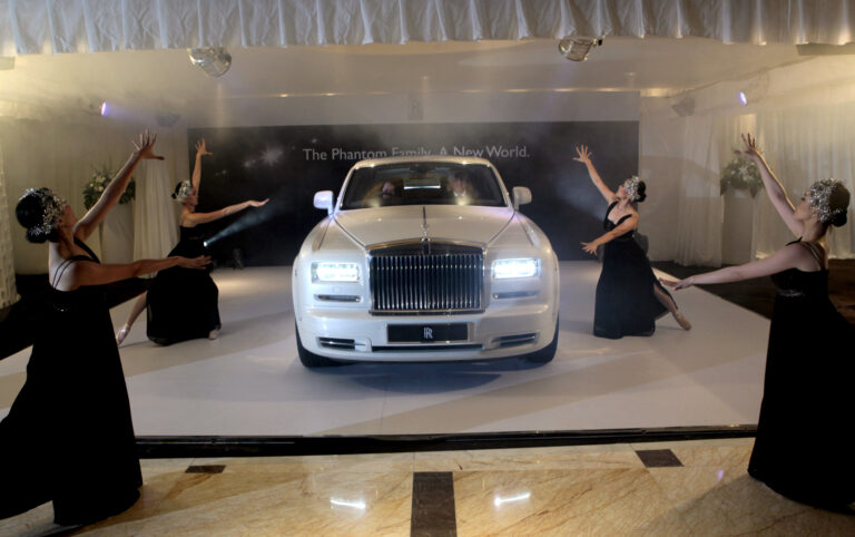 Dancers perform during the media launch of Rolls Royce Phantom Series II in Jakarta, Indonesia, Wednesday, June 20, 2012. The launch was the first in Southeast Asia. (AP Photo/Dita Alangkara)