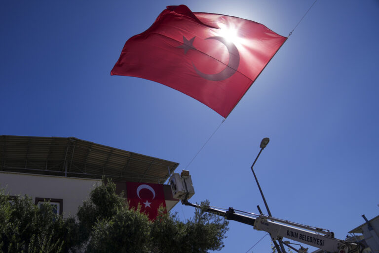 Municipality workers decorate the family house of Aysenur Ezgi Eygi, the 26 year-old Turkish-American activist killed by the Israeli military, with Turkish flags, in City of Didim, Turkey, Thursday, Sept. 12, 2024,(AP Photo/Khalil Hamra)