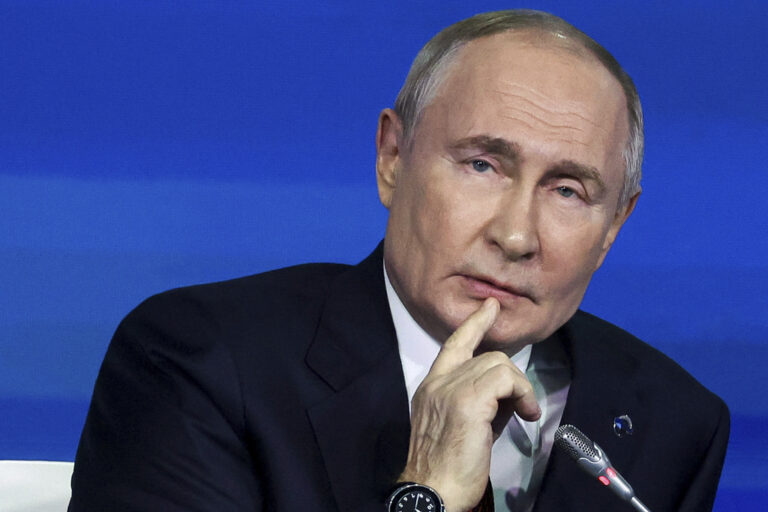 Russian President Vladimir Putin listens to a question during a meeting with foreign policy experts at the Valdai Discussion Club in the Black Sea resort of Sochi, Russia, Friday, Nov. 8, 2024. (Maxim Shipenkov/Pool Photo via AP)