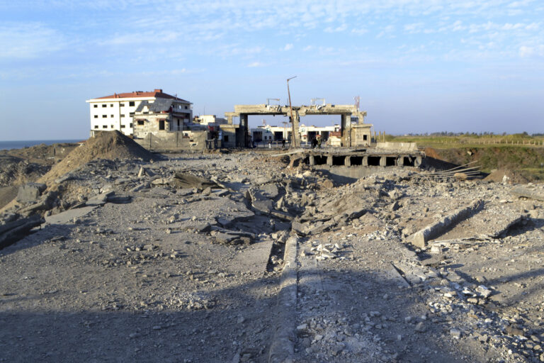 Destroyed roads are seen at the crossing border point between Lebanon and Syria which hit by an Israeli airstrike, in Arida, north Lebanon, Friday, Dec. 6, 2024. (AP Photo)