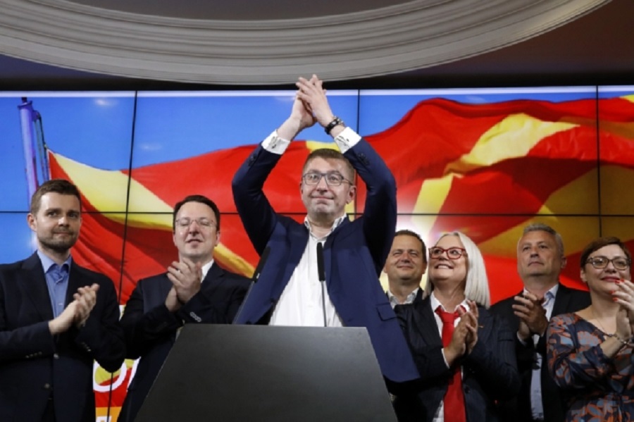 Hristijan Mickoski, the leader of the opposition center-right VMRO-DPMNE party waves after a news conference in Skopje, North Macedonia, on Wednesday, May 8, 2024. Citizens voted in North Macedonia on Wednesday in a parliamentary election and presidential runoff dominated by the country's slow path toward European Union membership and its sluggish economy. (AP Photo/Boris Grdanoski)