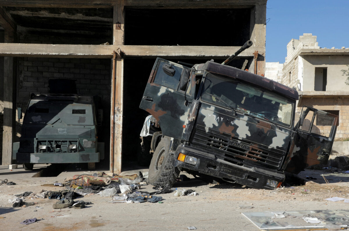 A damaged military vehicle lies in the city of Maarat al-Numan, in Idlib province, after rebel fighters captured the city, Syria December 1, 2024. REUTERS/Mahmoud Hassano