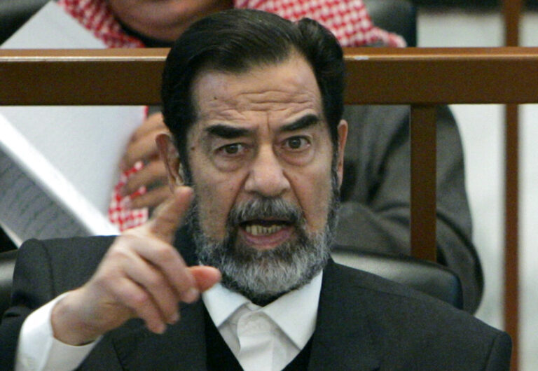 FILE This Thursday Dec. 21, 2006 file photo shows ousted Iraqi President Saddam Hussein in court while listening to the prosecution, during the Anfal genocide trial in Baghdad, Iraq.  Mass murderer Anders Behring Breivik's shocking testimony to a Norwegian court has revived a debate about how much of a public platform mass-murderers should be given in trials. Such atrocities are often waged for attention and carried out in the name of political or religious goals, and a trial gives perpetrators more of what they crave: a huge audience. Mike Newton, co-author of "Enemy of the State: The Trial and Execution of Saddam Hussein," argues that Saddam's trial is a case where there would indeed have been good argument for a closed trial because the deposed Iraqi dictator used his testimony _ broadcast on Iraqi television _ to encourage the ongoing insurgency.(AP Photo / Nikola Solic, pool)