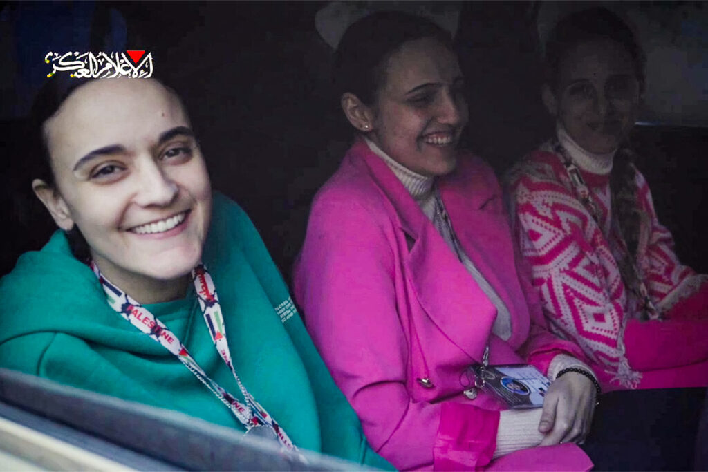 This image grab from a handout video released by the Hamas Media Office shows Israeli hostages (L to R) Emily Damari, Romi Gonen, and Doron Steinbracher, who were abducted by Palestinian militants during the October 7, 2023 attacks, sitting in a Hamas vehicle before being handed over to the International Committee of the Red Cross (ICRC) in the Gaza Strip on January 19, 2025 after a ceasefire and hostage-prisoner exchange deal in the war between Israel and Hamas was implemented. The first three Israeli hostages were released on January 19 under a long-awaited Gaza truce aimed at ending more than 15 months of war that has ravaged the Palestinian territory. (Photo by AFP) / == RESTRICTED TO EDITORIAL USE - MANDATORY CREDIT "AFP PHOTO / HO / HAMAS MEDIA OFFICE" - NO MARKETING NO ADVERTISING CAMPAIGNS - DISTRIBUTED AS A SERVICE TO CLIENTS ==