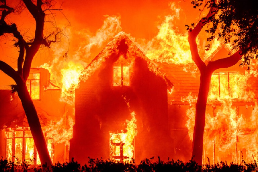 A home is engulfed in flames during the Eaton fire in the Altadena area of Los Angeles County, California on January 8, 2025. (Photo by JOSH EDELSON / AFP)