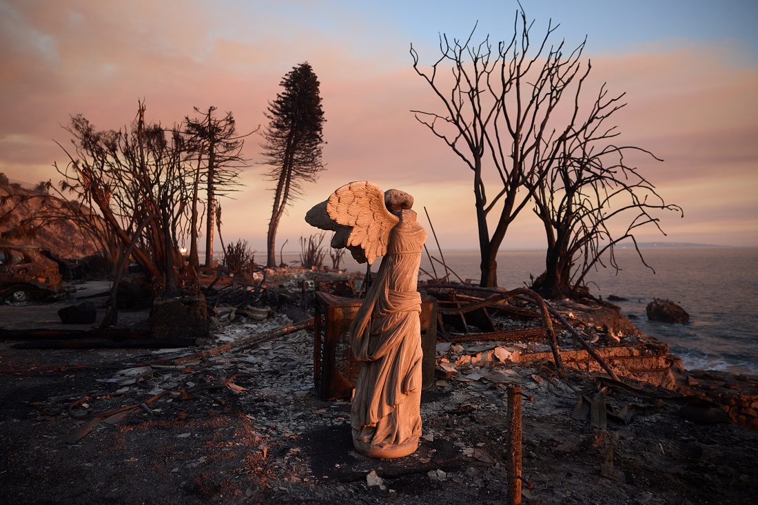 epa11817686 A statue of an angel remains among ruins of a home damaged by the Palisades wildfire in Malibu, California, USA, 10 January 2025.  Multiple wildfires continue to burn across thousands of acres in Southern California, destroying thousands of homes and forcing people to evacuate areas throughout the Los Angeles area. According to the California Governor’s office, more than 7,500 firefighting and emergency personnel are involved in response efforts.  EPA/ALLISON DINNER