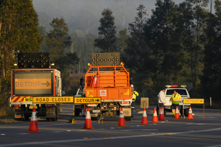 Emergency workers man a roadblock near the town of Greta following a bus crash in the Hunter Valley, north of Sydney, Australia, Monday, June 12, 2023. Australian police say that initial inquiries indicated multiple people had been killed in the overnight bus crash in New South Wales state. (AP Photo/Mark Baker)