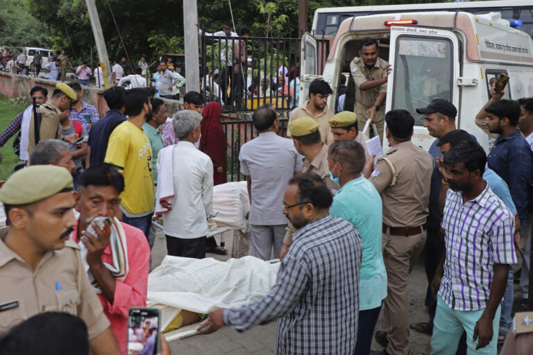 Relatives and volunteers carry the bodies on stretchers at the Sikandrarao hospital in Hathras district about 350 kilometers (217 miles) southwest of Lucknow, India, Tuesday, July 2, 2024. Thousands of people at a religious gathering rushed to leave a makeshift tent, setting off a stampede Tuesday that killed more than hundred people and injured scores. (AP Photo/Manoj Aligadi)