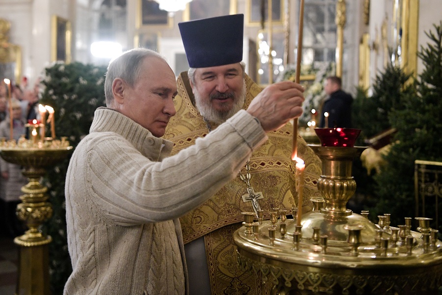 Russian President Vladimir Putin attends a Christmas liturgy at the Transfiguration Cathedral in Saint Petersburg early on January 7, 2020. - Orthodox Christians celebrate Christmas on January 7 in the Middle East, Russia and other Orthodox churches that use the old Julian calendar instead of the 17th-century Gregorian calendar adopted by Catholics, Protestants, Greek Orthodox and commonly used in secular life around the world (Photo by Alexey NIKOLSKY / SPUTNIK / AFP) (Photo by ALEXEY NIKOLSKY/SPUTNIK/AFP via Getty Images)