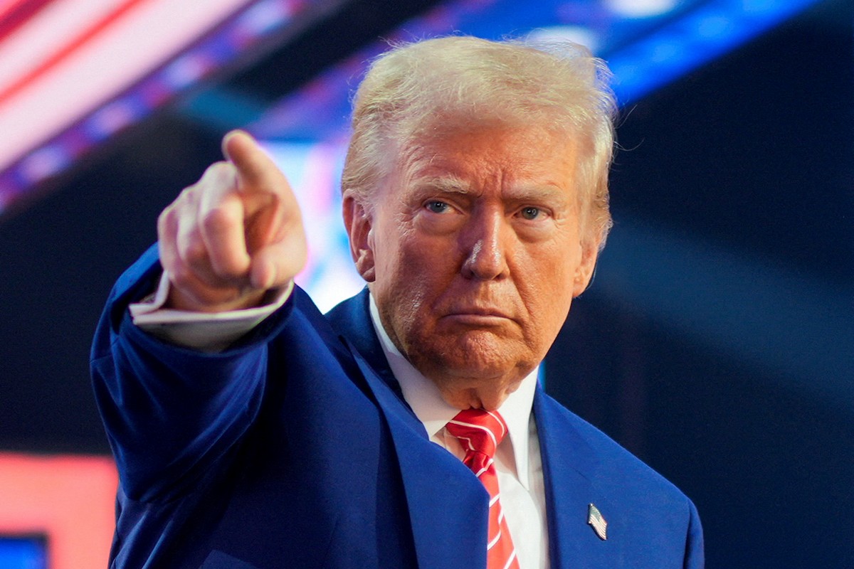 FILE PHOTO: U.S. President-elect Donald Trump gestures at Turning Point USA's AmericaFest in Phoenix, Arizona, U.S., December 22, 2024.  REUTERS/Cheney Orr/File Photo