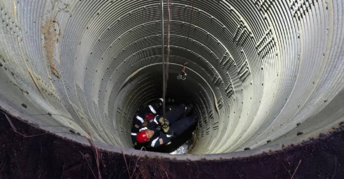 Firefighters used a rope system to descend into the silo to rescue the boy. Photograph: Sable Altura Fire Rescue via Facebook