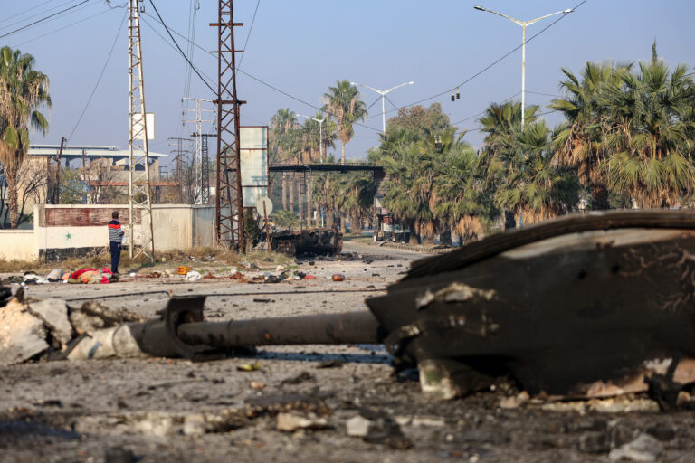 A destroyed Syrian army tank lies in a street in Hama, a day after rebels captured the central-west city, on December 6, 2024. In little over a week, the offensive by rebel forces has seen Syria's second city Aleppo and strategically located Hama fall from President Bashar al-Assad's control for the first time since the civil war began in 2011. (Photo by Mohammed AL-RIFAI / AFP)