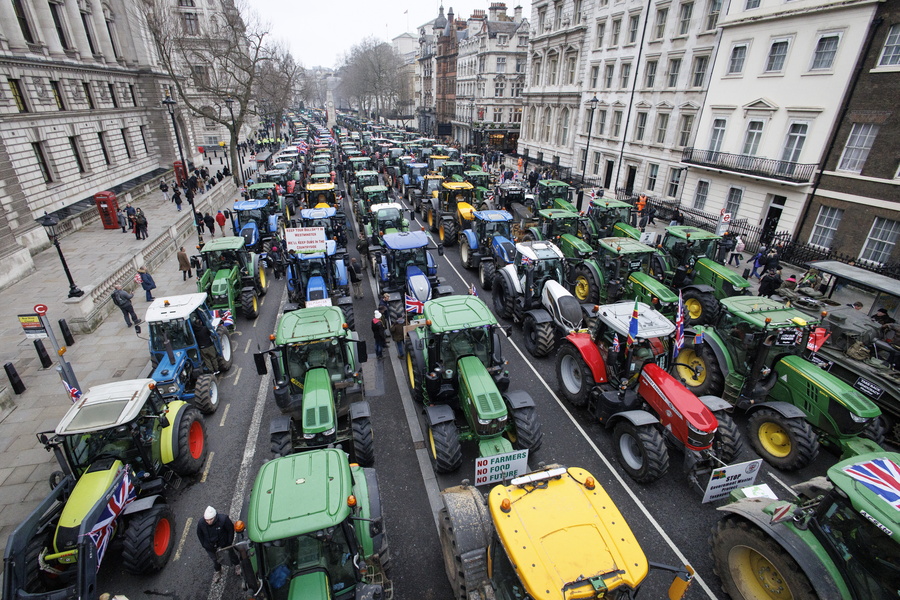 epa11886609 British farmers gridlock Whitehall with their tractors during a protest over changes to inheritance tax (IHT) rules, in London, Britain, 10 February 2025. British farmers demand a reversal of the changes to inheritance tax rules announced in the October 2024 budget by the Labour government, which will introduce new taxes on farms worth more than 1 million GBP that would apply from April 2026.  EPA/TOLGA AKMEN