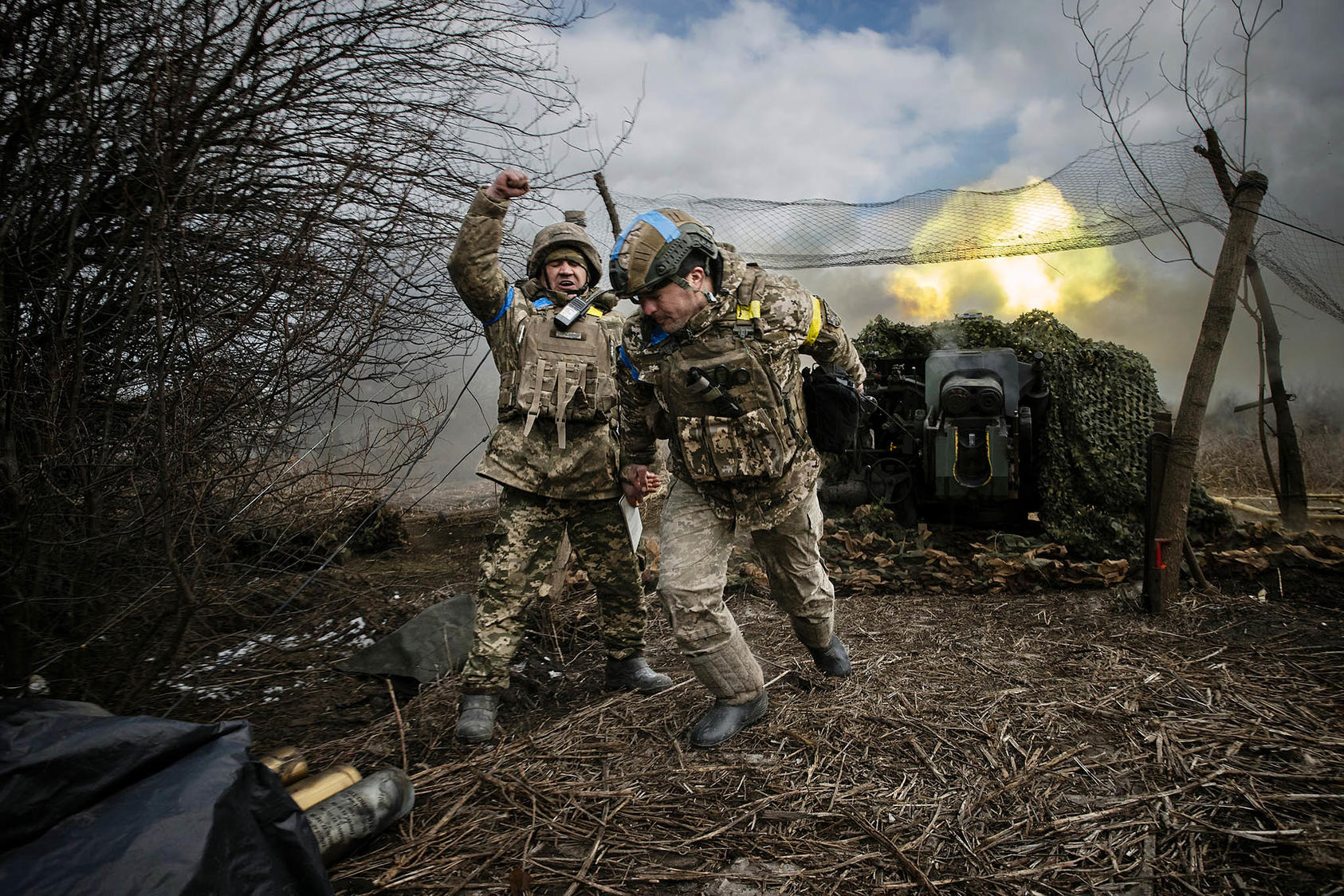 Ukrainian soldiers with the 31st Separate Mechanized Brigade fire a 122-millimeter howitzer D-30 at a Russian target in the Donetsk region of eastern Ukraine, Feb. 20, 2024. Western sanctions haven’t worked and weapons from allies are running low. Pressure may build on Kyiv to seek a settlement, even from a weakened position. (Tyler Hicks/The New York Times)