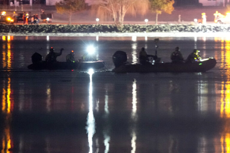 Boats work the scene in the Potomac River near Ronald Reagan Washington National Airport, Thursday, Jan. 30, 2025, in Arlington, Va. (AP Photo/Alex Brandon)